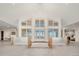 Grand foyer with natural light and custom wood and tile flooring at 12565 Picadilly Rd, Commerce City, CO 80022