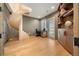 A well-lit home office with a spiral staircase and wood floors at 12565 Picadilly Rd, Commerce City, CO 80022