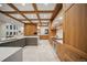 A view of an eat-in kitchen with modern appliances and custom wood cabinets at 12565 Picadilly Rd, Commerce City, CO 80022