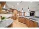 Beautiful kitchen with gray countertops, wood cabinets, and stainless steel appliances at 12565 Picadilly Rd, Commerce City, CO 80022