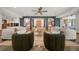 Open living room with statement archways, comfortable seating, and natural light at 12565 Picadilly Rd, Commerce City, CO 80022