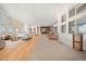 Bright and open living room with hardwood floors, high ceilings, and large windows with ample light at 12565 Picadilly Rd, Commerce City, CO 80022