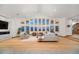 Spacious living room boasting hardwood floors, high ceilings, and custom lighting at 12565 Picadilly Rd, Commerce City, CO 80022