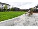 Backyard with a concrete patio and lush green lawn, providing a peaceful outdoor space at 9 N Waterloo St, Aurora, CO 80018