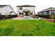 Spacious backyard with a well-maintained lawn, patio area, and modern fencing, ideal for outdoor activities at 9 N Waterloo St, Aurora, CO 80018