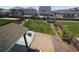Aerial view of the expansive backyard with lush lawn, garden beds, and patio, perfect for outdoor activities at 9 N Waterloo St, Aurora, CO 80018