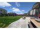 Large backyard featuring a well-maintained lawn, patio with seating, and a trampoline for Gathering fun at 9 N Waterloo St, Aurora, CO 80018