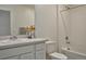 Bathroom featuring a vanity and a combined bathtub and shower at 9 N Waterloo St, Aurora, CO 80018