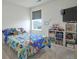 Bright bedroom with toys, television, and a playful atmosphere at 9 N Waterloo St, Aurora, CO 80018