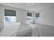 A bedroom filled with natural light from the large windows at 9 N Waterloo St, Aurora, CO 80018