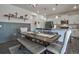 Dining room features modern pendant lighting, a large wooden table, and stylish seating at 9 N Waterloo St, Aurora, CO 80018