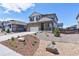 Charming two-story home features a well-manicured, low-maintenance front yard and attached two-car garage at 9 N Waterloo St, Aurora, CO 80018