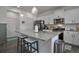 Kitchen with granite countertops, stainless steel appliances, and a breakfast bar at 9 N Waterloo St, Aurora, CO 80018