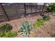 Landscaped area with purple flowers by the fence, adding color and charm to the outdoor space at 9 N Waterloo St, Aurora, CO 80018
