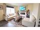 Comfortable living room features neutral furniture, an electric fireplace, and a wall-mounted TV at 9 N Waterloo St, Aurora, CO 80018