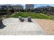 Relaxing patio area with comfortable seating, overlooking a well-manicured lawn and landscaped backyard at 9 N Waterloo St, Aurora, CO 80018
