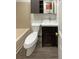 Clean bathroom with a white sink, toilet, and bathtub at 1885 S Quebec Way # B23, Denver, CO 80231