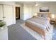 Virtually staged bedroom with light grey carpet and ample closet space at 1885 S Quebec Way # B23, Denver, CO 80231