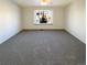 Large bedroom with carpet and big window at 1885 S Quebec Way # B23, Denver, CO 80231