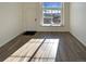 Bright living room with large window and hardwood floors at 1885 S Quebec Way # B23, Denver, CO 80231