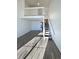 Open living area with loft and staircase at 1885 S Quebec Way # B23, Denver, CO 80231