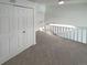 Loft bedroom with double closets and carpeting at 1885 S Quebec Way # B23, Denver, CO 80231