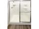 Clean shower with sliding glass doors and built-in shelves at 1885 S Quebec Way # B23, Denver, CO 80231