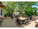Back patio offers plenty of space for dining and relaxing outdoors with mature trees at 11433 Decatur Ct, Westminster, CO 80234