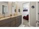 Stylish bathroom features double sink vanity, granite countertop, and tile wall; modern and sophisticated at 11433 Decatur Ct, Westminster, CO 80234