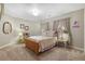 Charming bedroom with wood bed frame, soft lighting, and decorative accents at 11433 Decatur Ct, Westminster, CO 80234