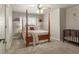Cozy bedroom featuring a four-poster bed, ceiling fan, and bright decor with ample natural light at 11433 Decatur Ct, Westminster, CO 80234