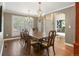 Elegant dining room with large table and traditional chandelier at 11433 Decatur Ct, Westminster, CO 80234