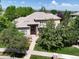 Beautiful two-story home with lush landscaping, inviting entrance, and tile roof in a desirable neighborhood at 11433 Decatur Ct, Westminster, CO 80234