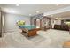 Finished basement game room with ping pong table and stone archway leading to other spaces at 11433 Decatur Ct, Westminster, CO 80234