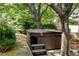 Backyard hot tub surrounded by lush landscaping, offering a private retreat at 11433 Decatur Ct, Westminster, CO 80234