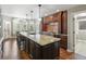 Spacious kitchen with center island, breakfast bar, and stainless steel appliances at 11433 Decatur Ct, Westminster, CO 80234