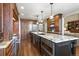 Spacious kitchen with a large center island, granite countertops, and stainless steel appliances and fixtures at 11433 Decatur Ct, Westminster, CO 80234