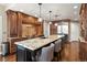 Gourmet kitchen with granite countertops, stainless steel appliances, and custom wood cabinetry at 11433 Decatur Ct, Westminster, CO 80234