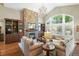 Inviting living room with stone fireplace, built-in shelving, vaulted ceilings, and lots of natural light at 11433 Decatur Ct, Westminster, CO 80234