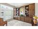 Stylish home office with custom built-in shelving and ample natural light at 11433 Decatur Ct, Westminster, CO 80234