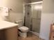 Cozy bathroom featuring a shower, tile flooring, and a toilet at 9625 E Center Ave # 4C, Denver, CO 80247