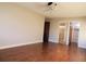 Spacious bedroom with hardwood floors and access to a closet and the bathroom at 9625 E Center Ave # 4C, Denver, CO 80247