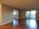 Spacious living room features hardwood floors and ample natural light at 9625 E Center Ave # 4C, Denver, CO 80247