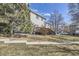 Backyard featuring a wooden deck with stairs leading down to a grassy area, perfect for outdoor activities at 2235 Coronado Pkwy # A, Denver, CO 80229