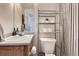 Well-organized bathroom with ample storage space, a sleek vanity, and neutral color palette at 2235 Coronado Pkwy # A, Denver, CO 80229