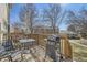 Spacious outdoor deck with a grill, table, and chairs perfect for al fresco dining and entertaining at 2235 Coronado Pkwy # A, Denver, CO 80229