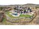 Aerial view of a luxury home with a pool, lush lawn, and fenced property at 3148 Keep Dr, Sedalia, CO 80135