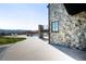 Stunning stone house exterior with pool, outdoor shower, and beautiful scenery at 3148 Keep Dr, Sedalia, CO 80135