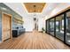 Hallway features a wood-paneled ceiling, a beverage station, and sliding doors at 3148 Keep Dr, Sedalia, CO 80135