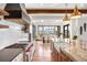 Gourmet kitchen with an island and stainless steel appliances that opens to the dining room and landscape views at 3148 Keep Dr, Sedalia, CO 80135